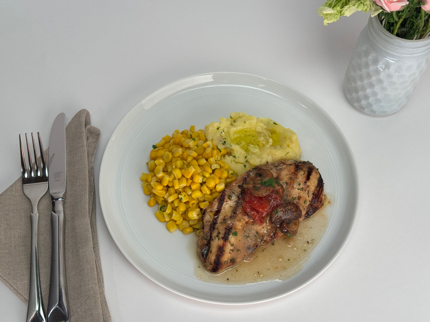 Mushroom chicken with smashed yukon potatoes and sweet corn