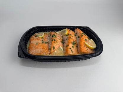 Freshly seared Salmon with lemon velouté paired with turmeric rice with pickled garlic and seasoned green beans with diced tomatoes