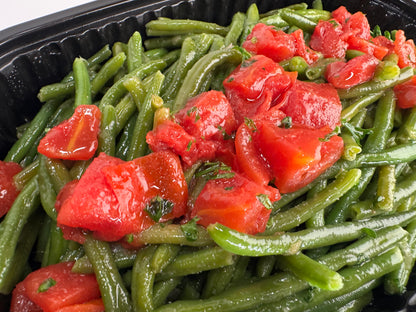 Freshly seared Salmon with lemon velouté paired with turmeric rice with pickled garlic and seasoned green beans with diced tomatoes