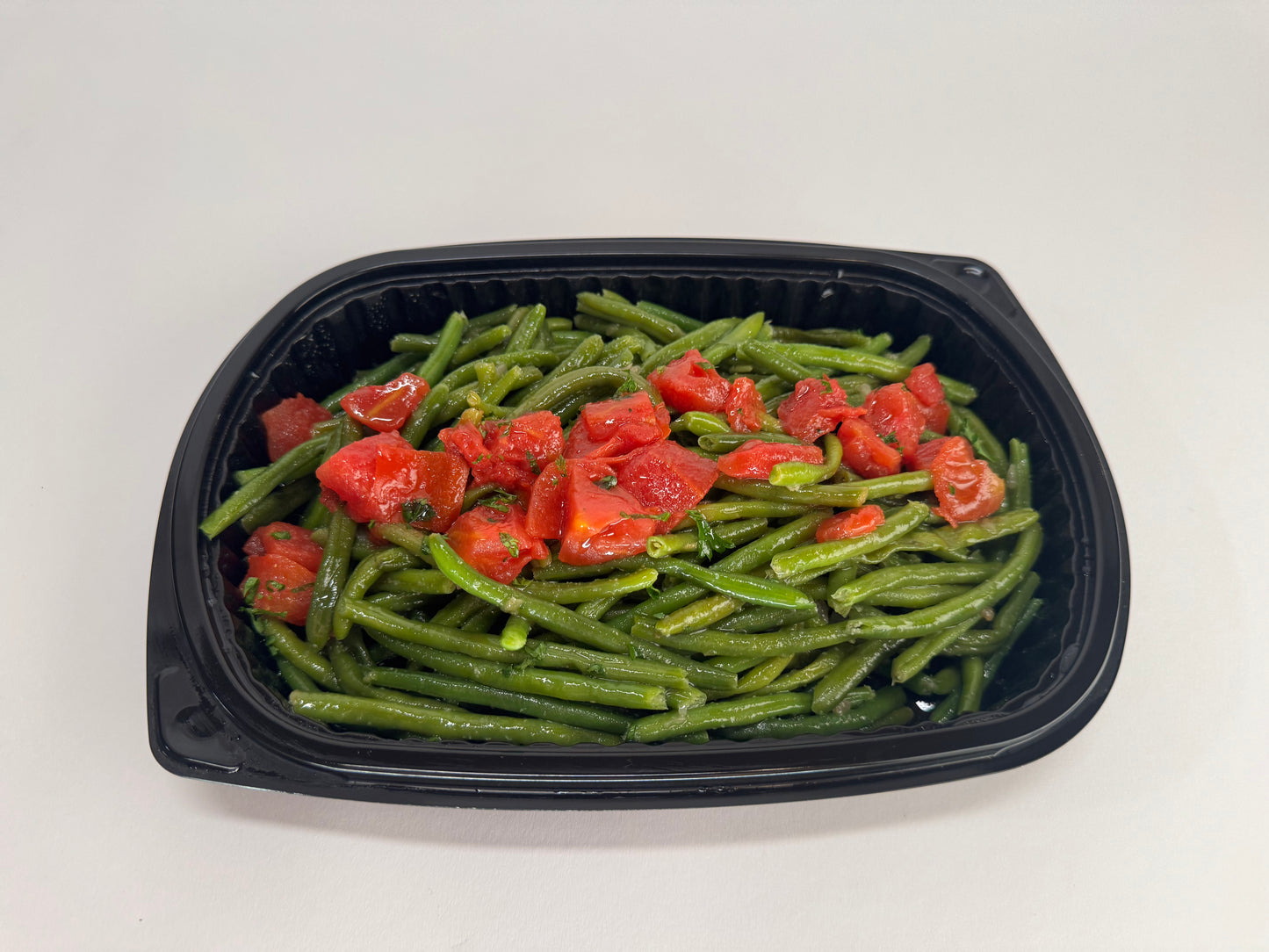 Freshly seared Salmon with lemon velouté paired with turmeric rice with pickled garlic and seasoned green beans with diced tomatoes